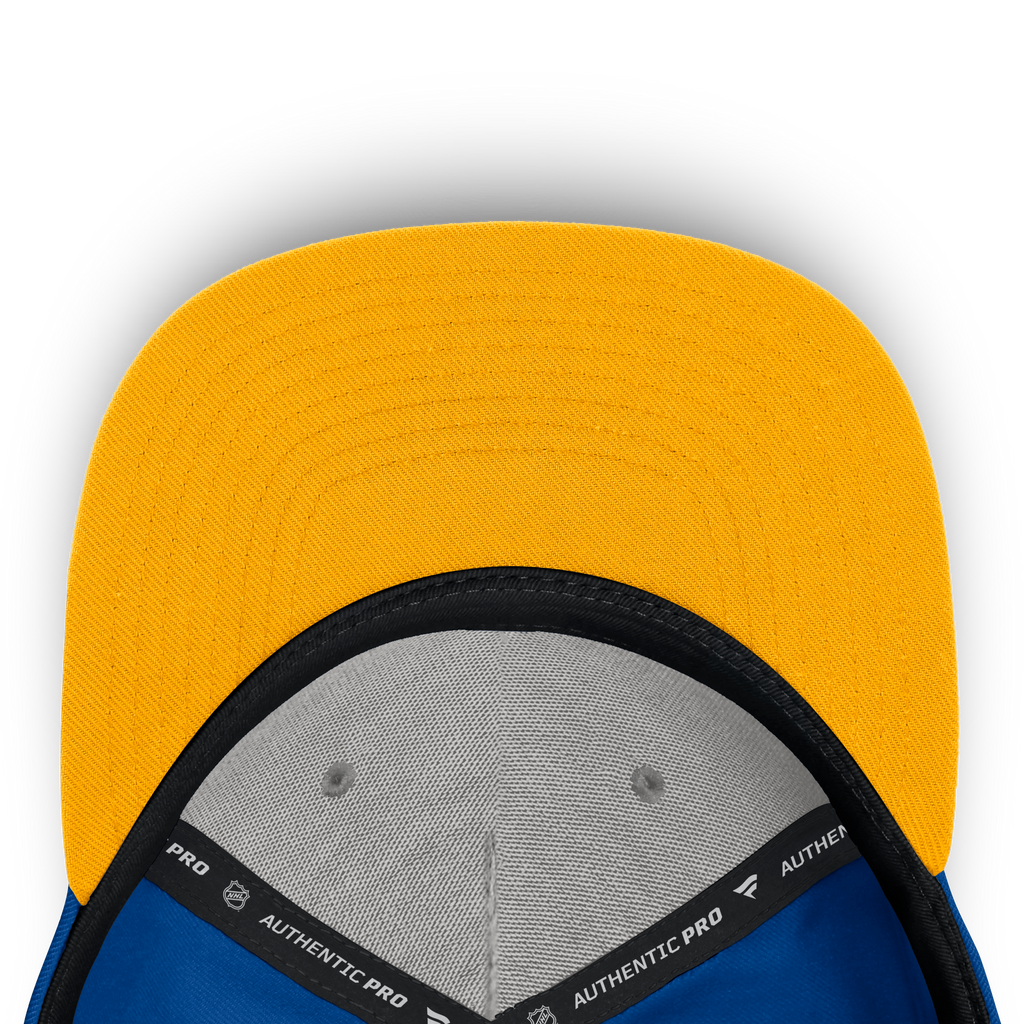 Close-up of a yellow and blue cap with 'Authentic Pro' branding on a white background