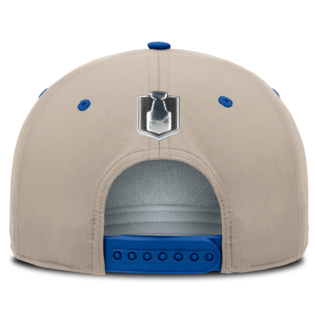 Beige cap with blue accents and a logo on the back against a white background