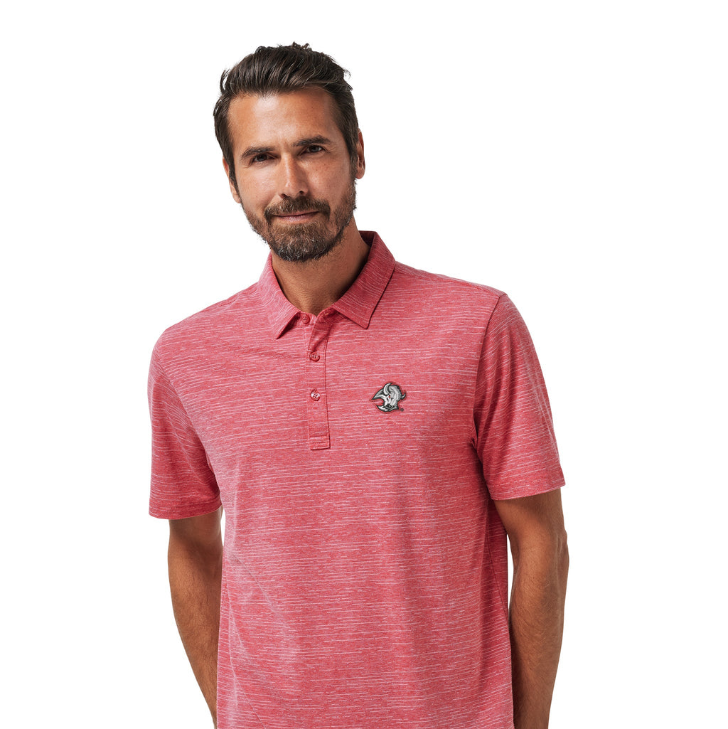 A man wearing a heathered coral-red short-sleeve polo shirt with a small embroidered logo on the left chest, paired with dark pants, against a plain white background.
