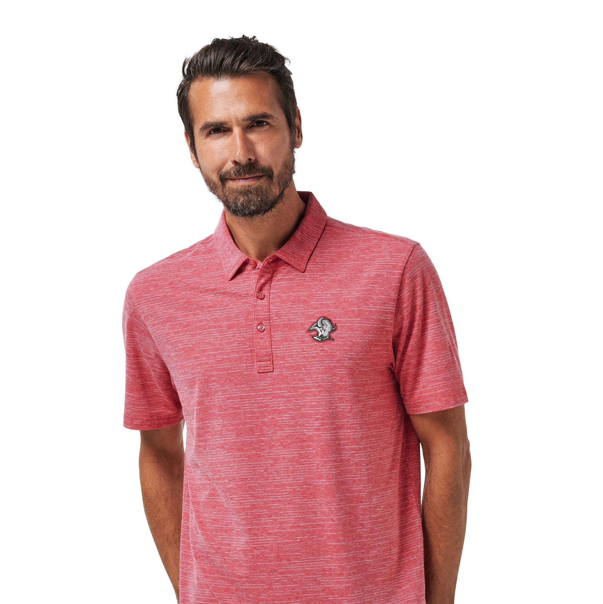 A man wearing a heathered coral-red short-sleeve polo shirt with a small embroidered logo on the left chest, paired with dark pants, against a plain white background.