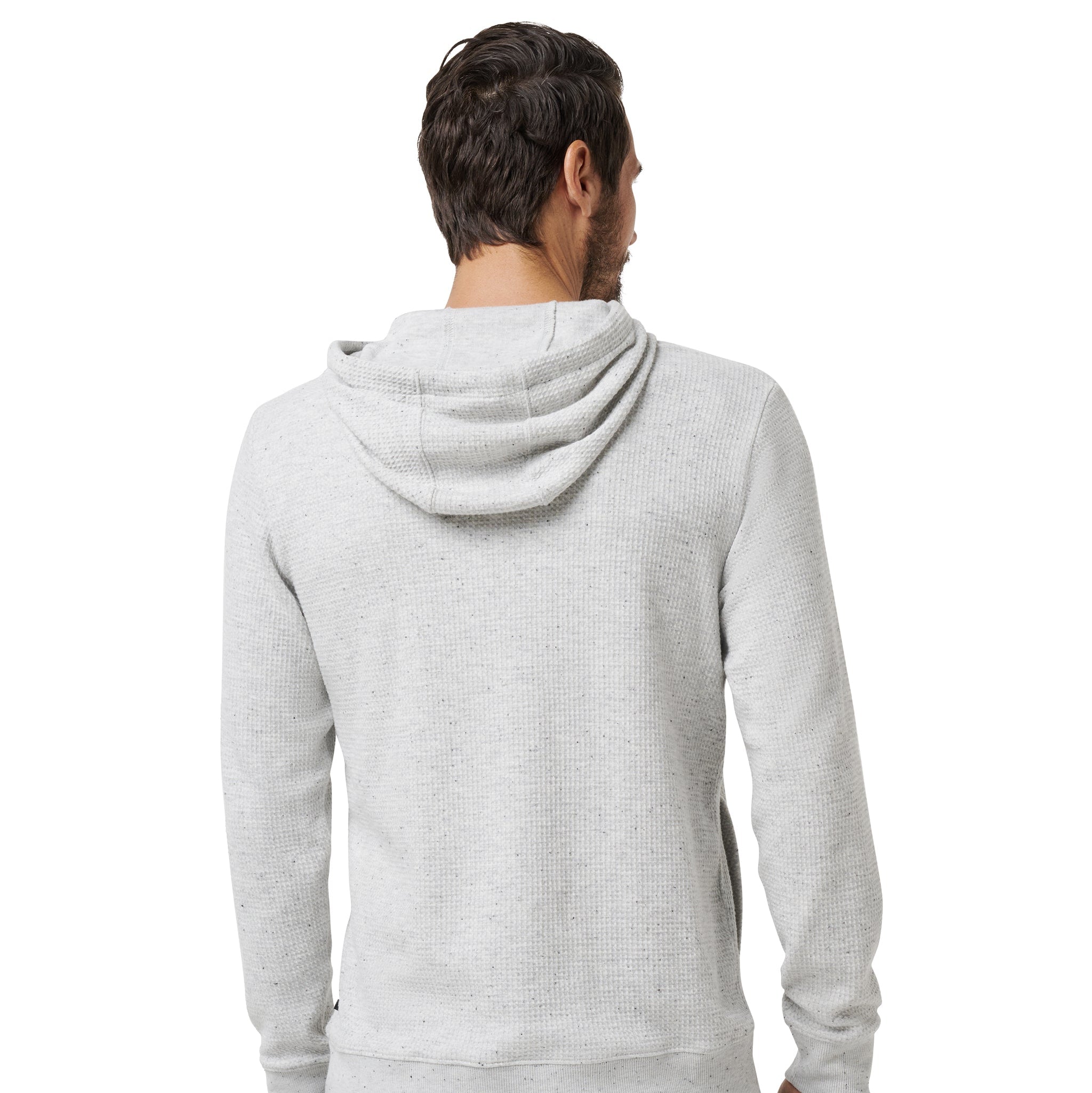 A man viewed from the back wearing a light heather gray hooded sweatshirt and dark blue jeans against a plain white background.