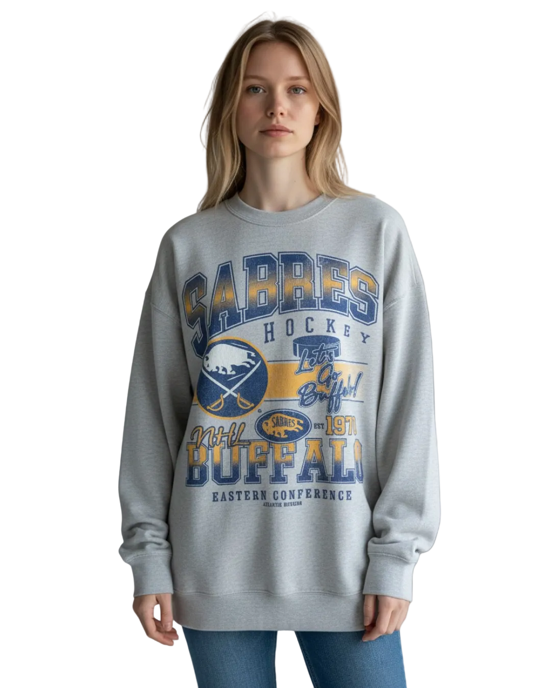 Person wearing a gray sweatshirt with sports team branding on a plain background