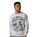Man wearing a gray 'Sabres Hockey' sweatshirt with blue and yellow text on a gray background