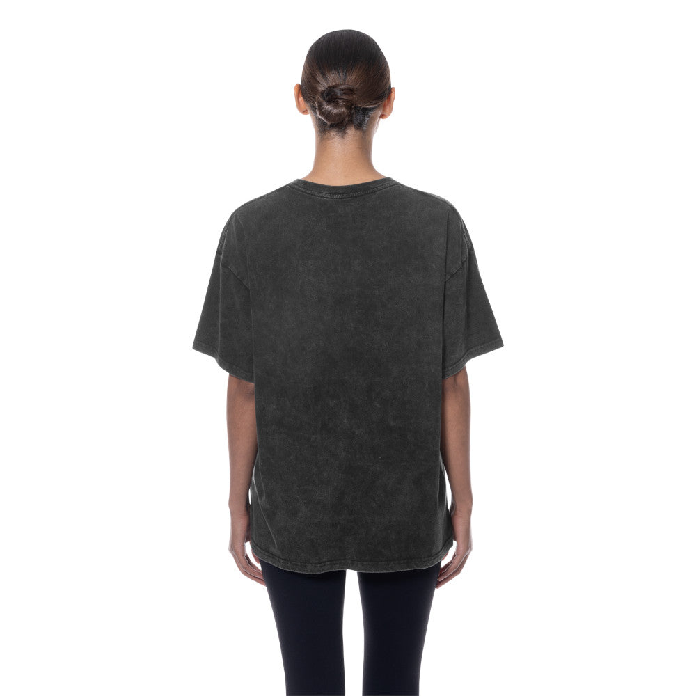 A person viewed from the back wearing an oversized dark charcoal gray washed t-shirt and black leggings against a plain white background.