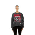 A woman modeling a dark gray washed sweatshirt with a distressed red and white Buffalo Sabres 1978 graphic on the front, paired with black pants against a solid white background.