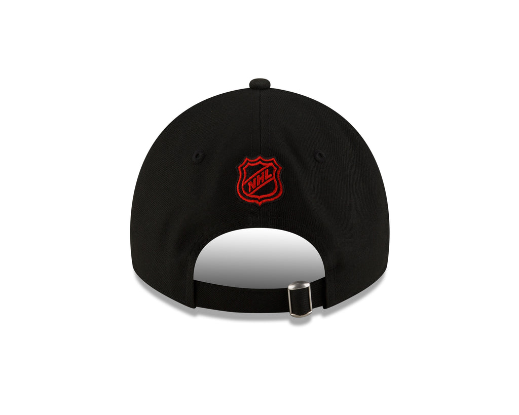 Black cap with a red logo on a white background