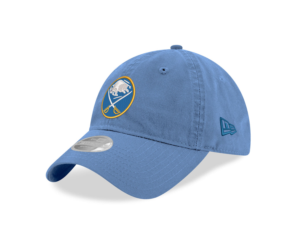 Blue baseball cap with a logo on a white background