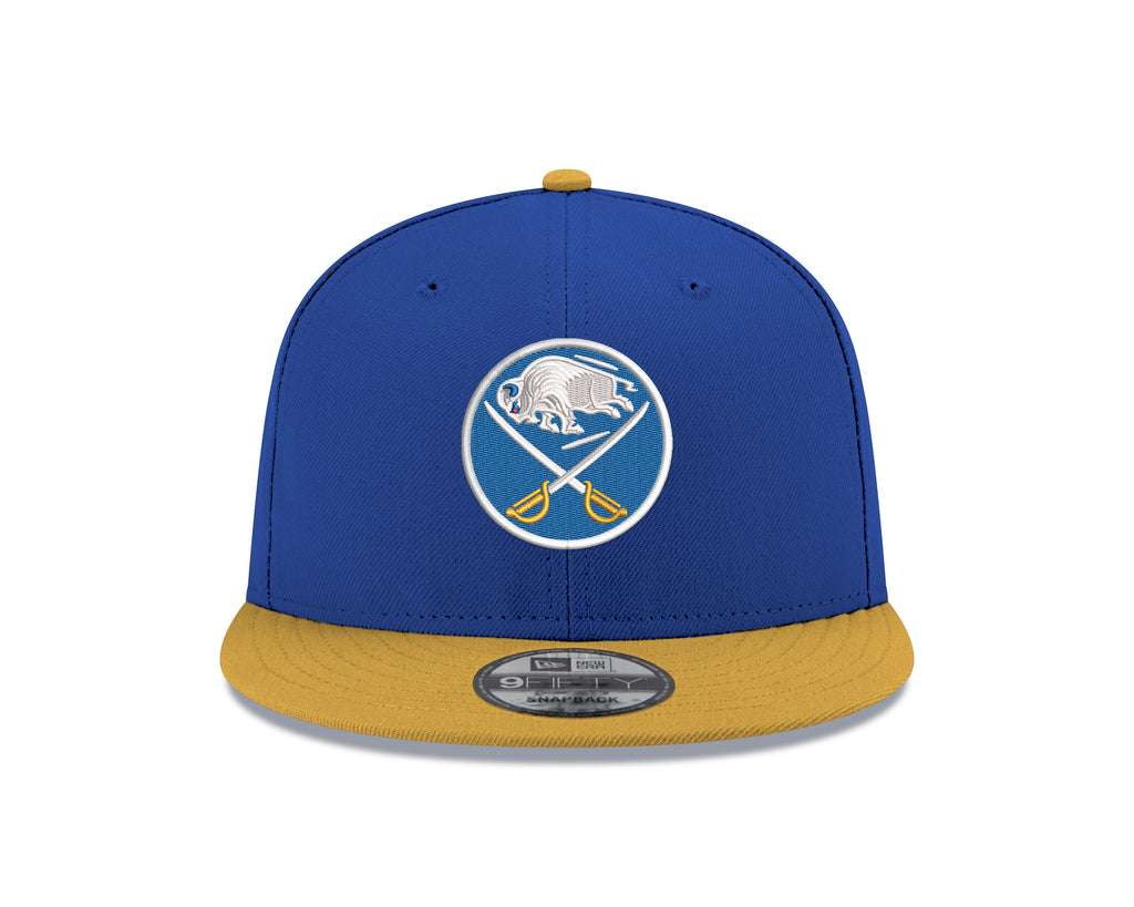 Blue and yellow baseball cap with a logo on a white background