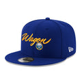 Blue cap with Wagon in yellow script text and Buffalo Sabres logo