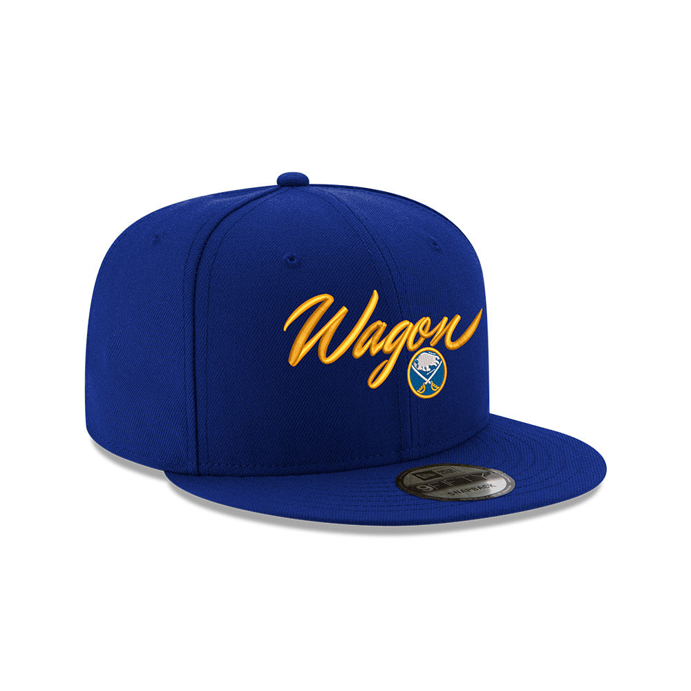Blue cap with Wagon in yellow script text and Buffalo Sabres logo