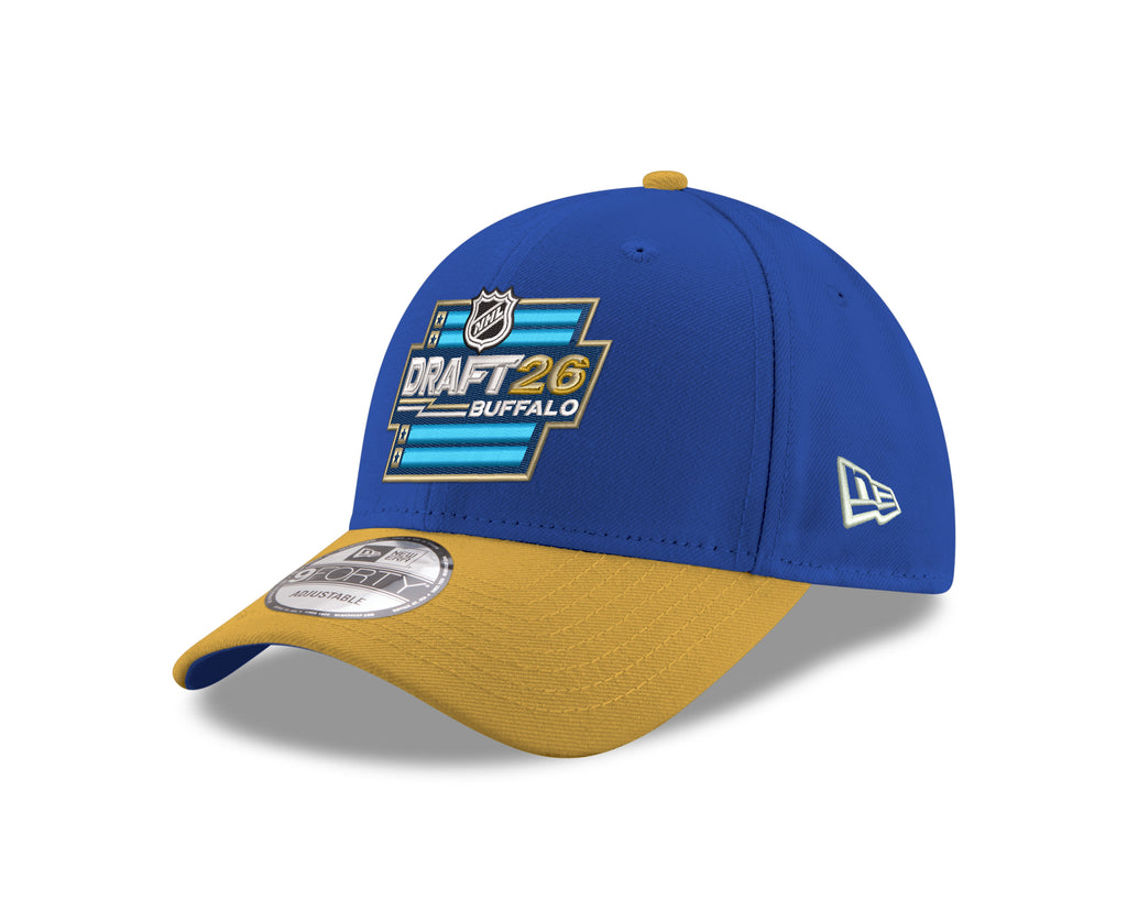 Blue and yellow cap with NHL Draft 26 logo on a white background