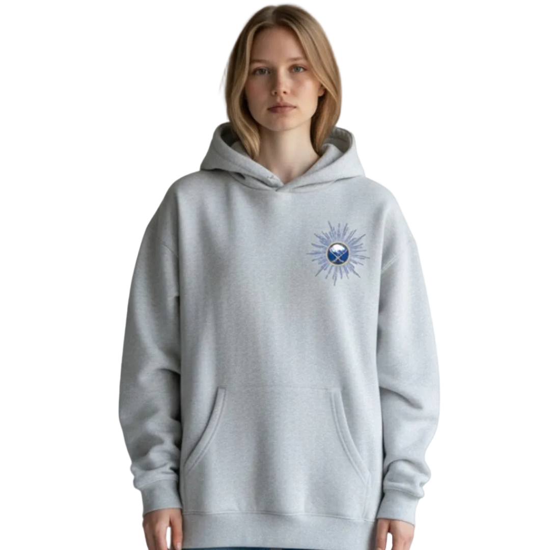 Person wearing a gray hoodie with a logo on a plain background