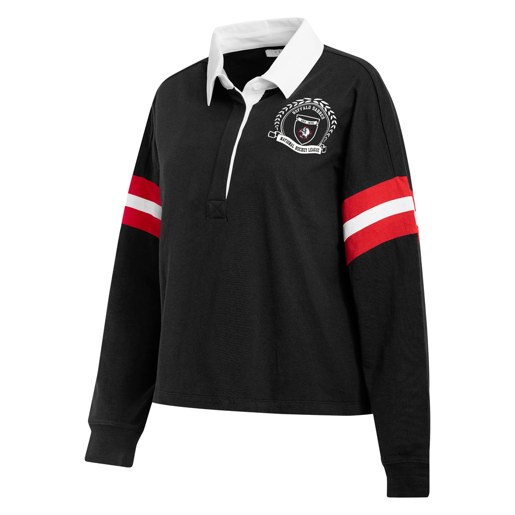 A black long-sleeve rugby shirt with a white collar, featuring red and white stripes on the sleeves and a white crest on the left chest, displayed on a clean white background.