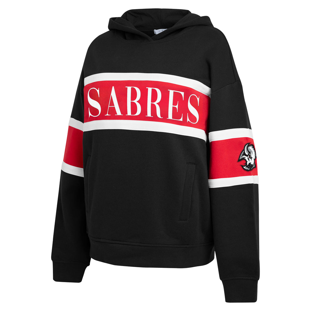 A black pullover hoodie with a red and white horizontal stripe across the chest featuring the word 'SABRES' in white. The right sleeve has a red and white stripe with a small Native head logo, and the left sleeve has a matching red and white stripe with a small red tab.