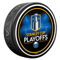 Hockey puck with Stanley Cup Playoffs logo on a white background
