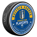 Hockey puck with Buffalo Sabres Stanley Cup Playoffs branding on a white background