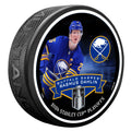 Hockey puck with a player image and Buffalo Sabres branding