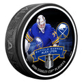 Hockey puck with a player image and text on a black background