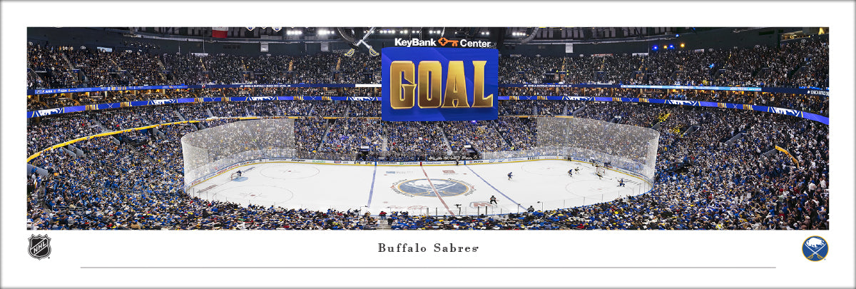 Hockey arena with 'GOAL' text and crowd in the stands