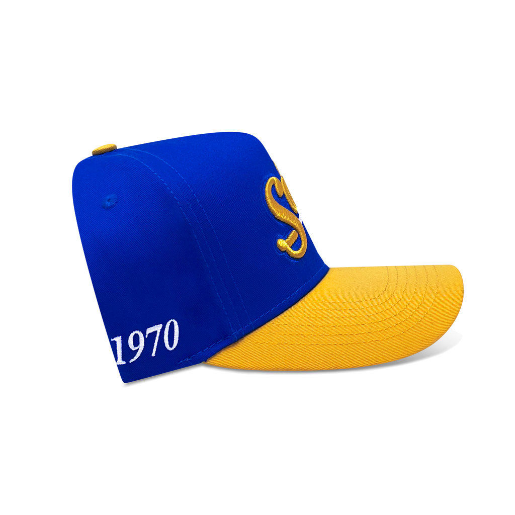 Blue and yellow cap with '1970' and logo on a white background
