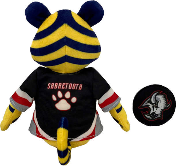A plush toy shaped like a tiger mascot wearing a black Sabretooth hockey-style jersey, shown from the back with a separate circular patch or badge displayed beside it on a plain white background.